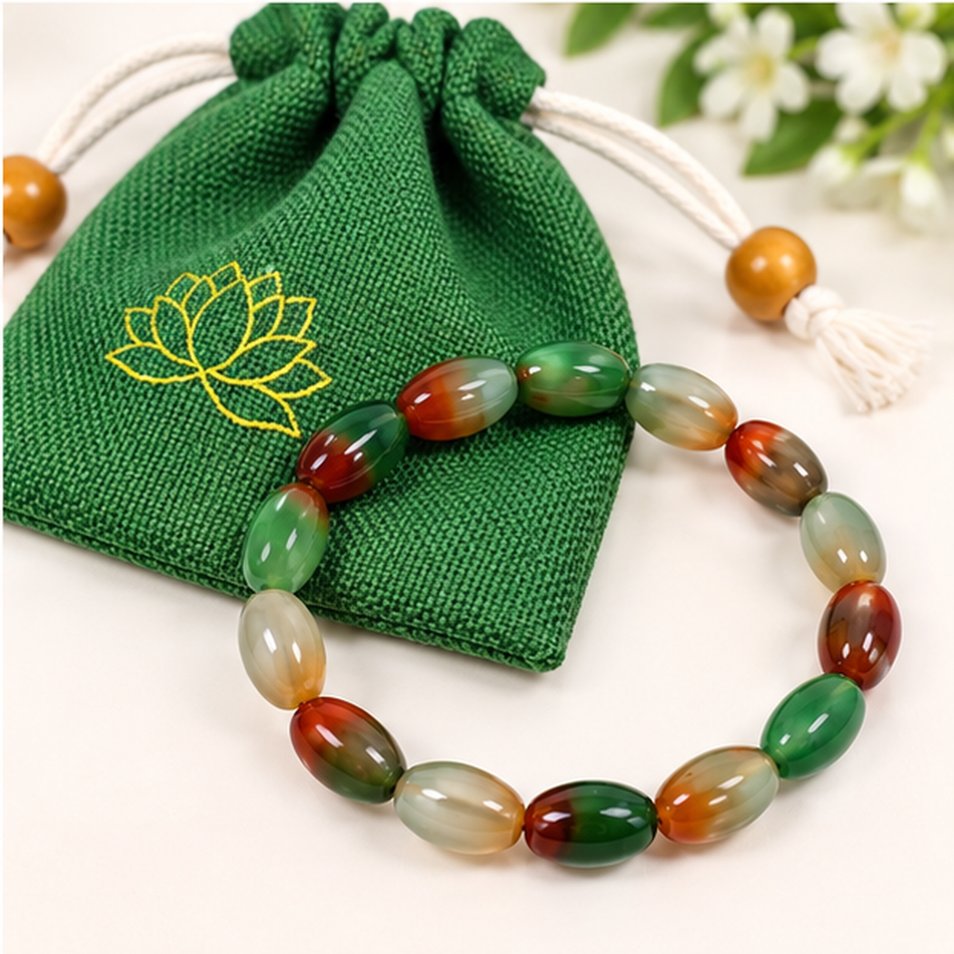 Bracelet extensible agate paon perles ovales 8mm avec pochette