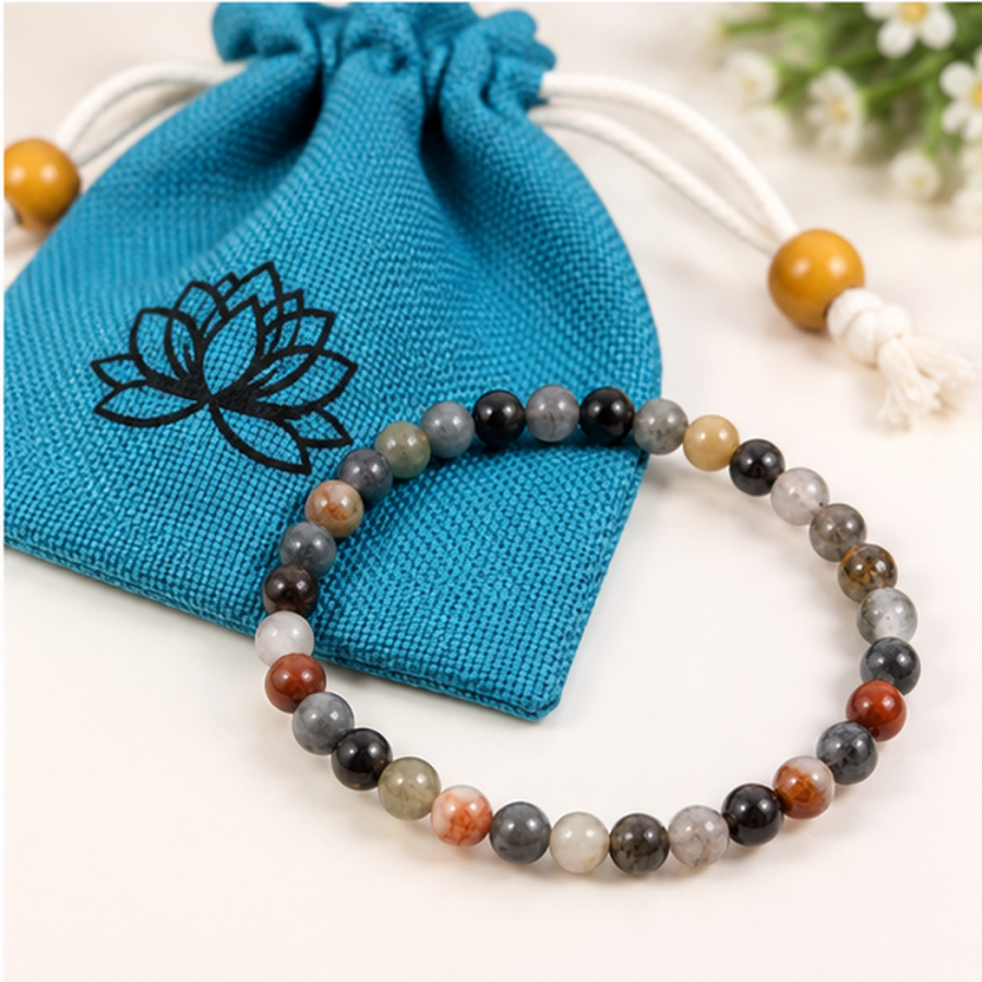 Bracelet extensible œil d’aigle perles rondes 6mm avec pochette