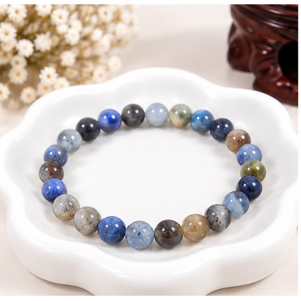 Bracelet extensible en Cyanite naturelle 6mm avec ses nuances naturelles de bleu et de gris