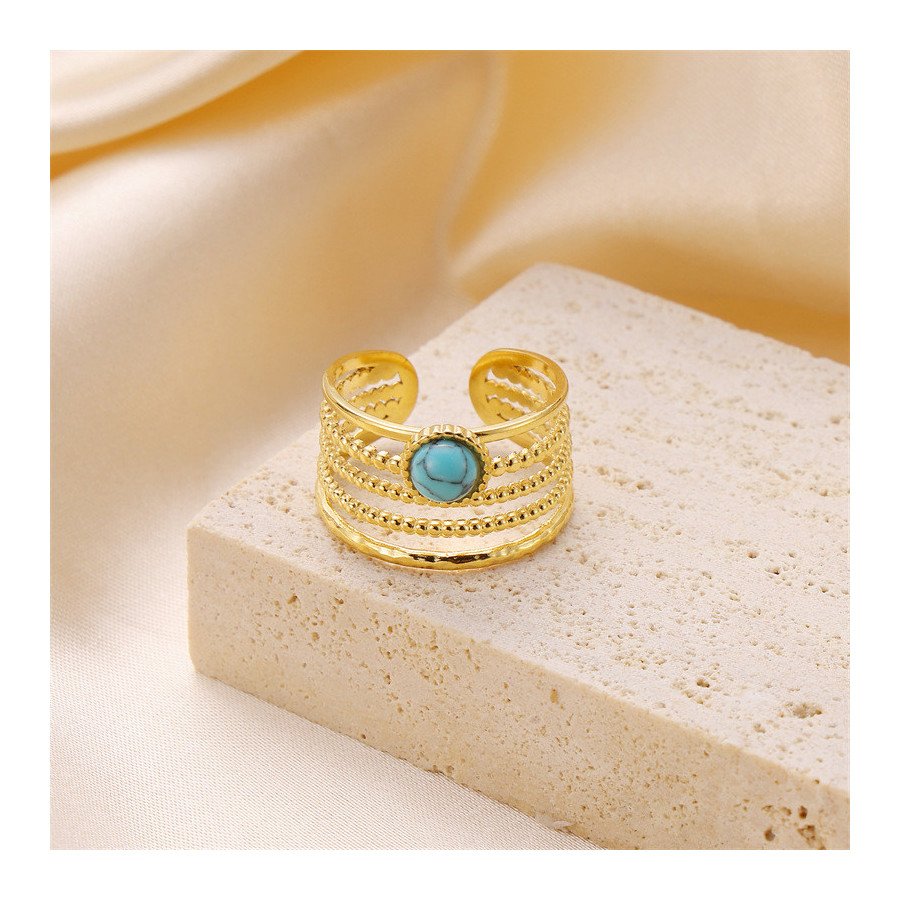 Bague élégante en acier inoxydable plaqué or 18k avec design ajustable et pierre turquoise.